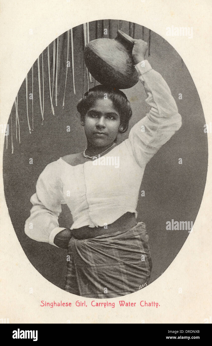 Sri Lanka - Sinhalese Girl carrying a Water Jar Stock Photo