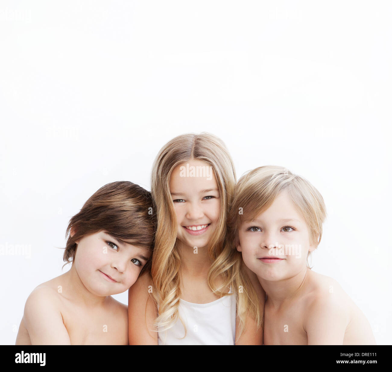 Portrait of siblings on white background Stock Photo