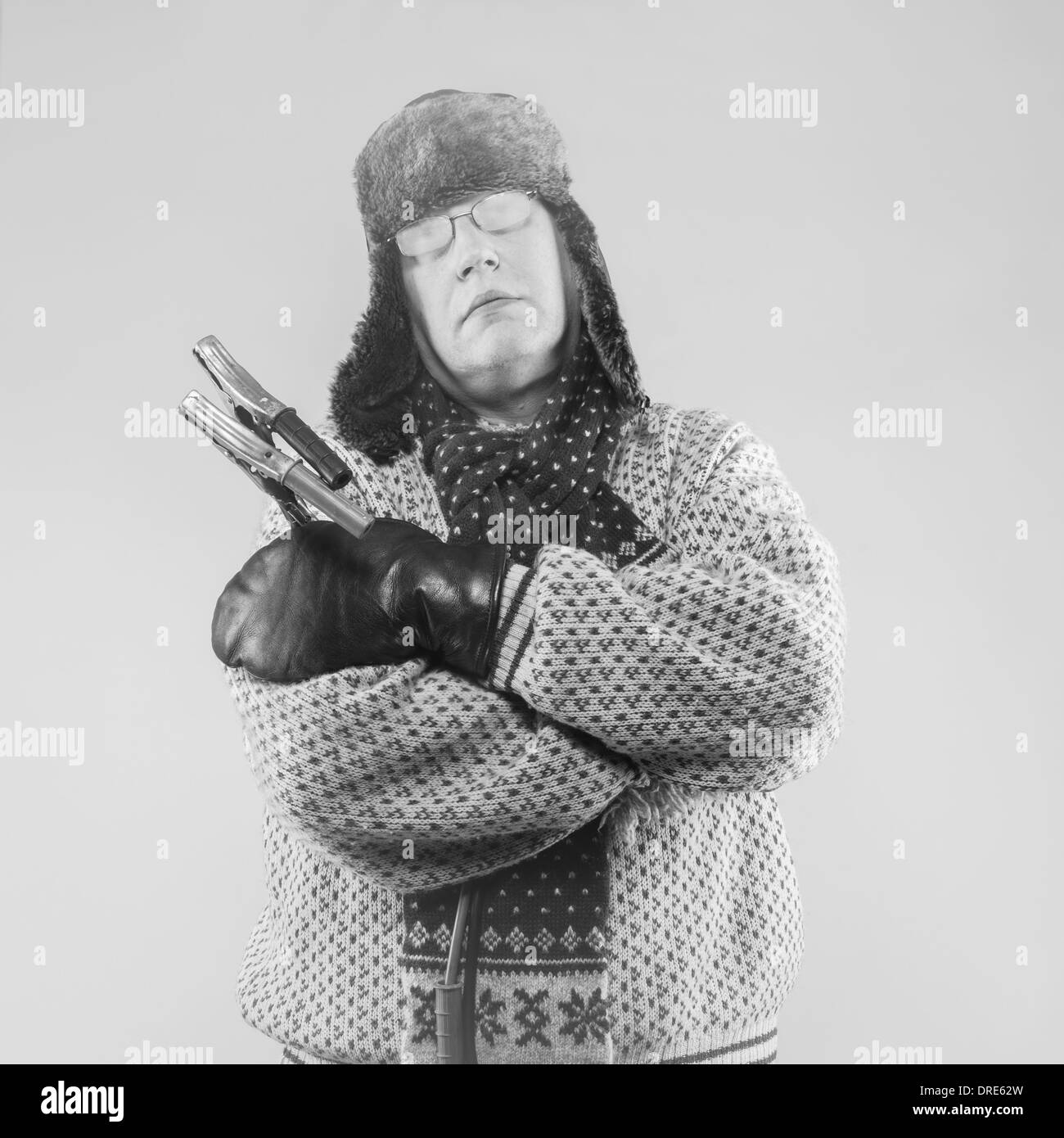 Frozen man with the jumper cables, black and white image Stock Photo