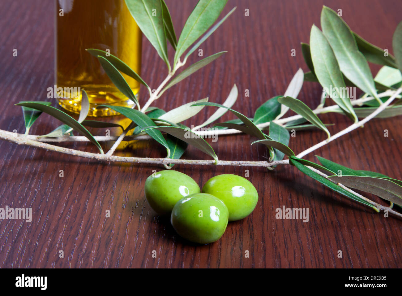 Green olives and oil Stock Photo - Alamy