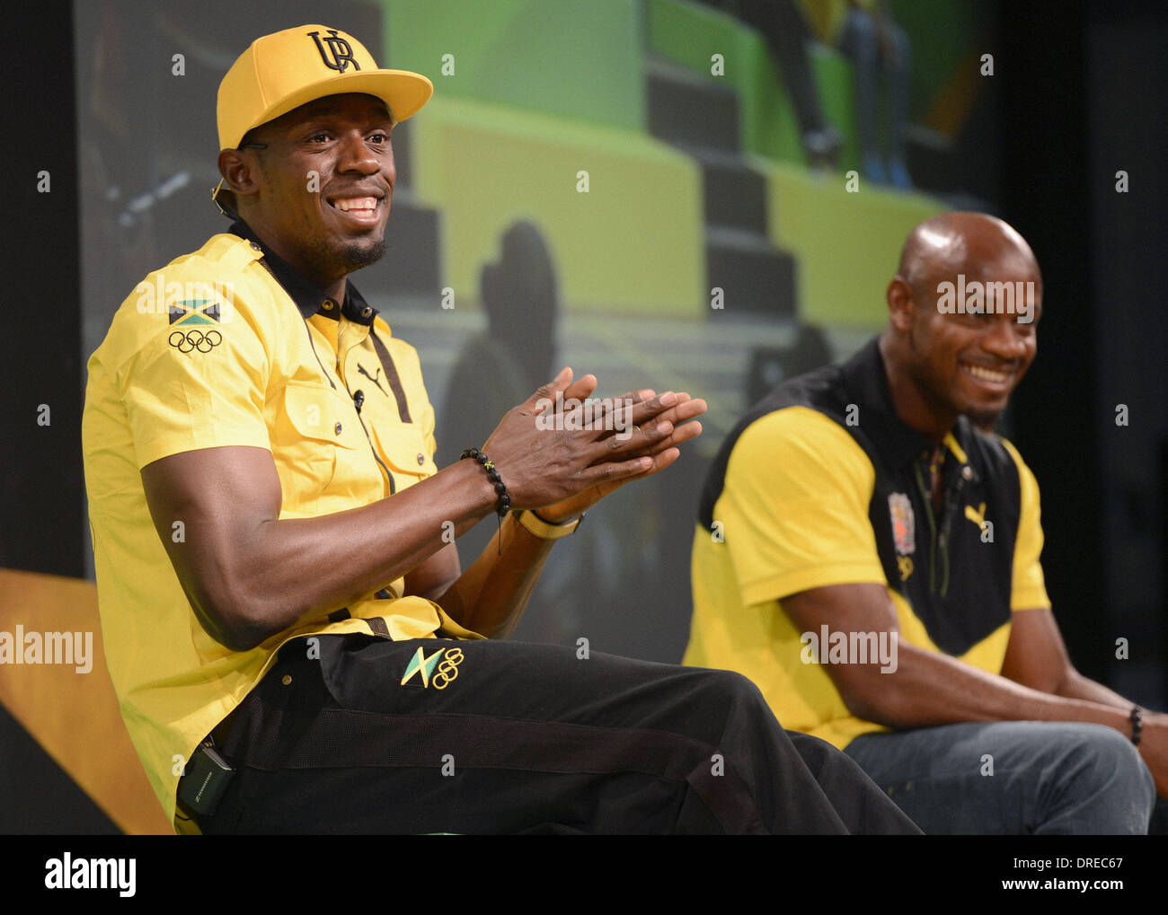 Usain Bolt of Jamaica and teammate Asafa Powell  attend a press conference in London London, England - 26.07.12 Stock Photo