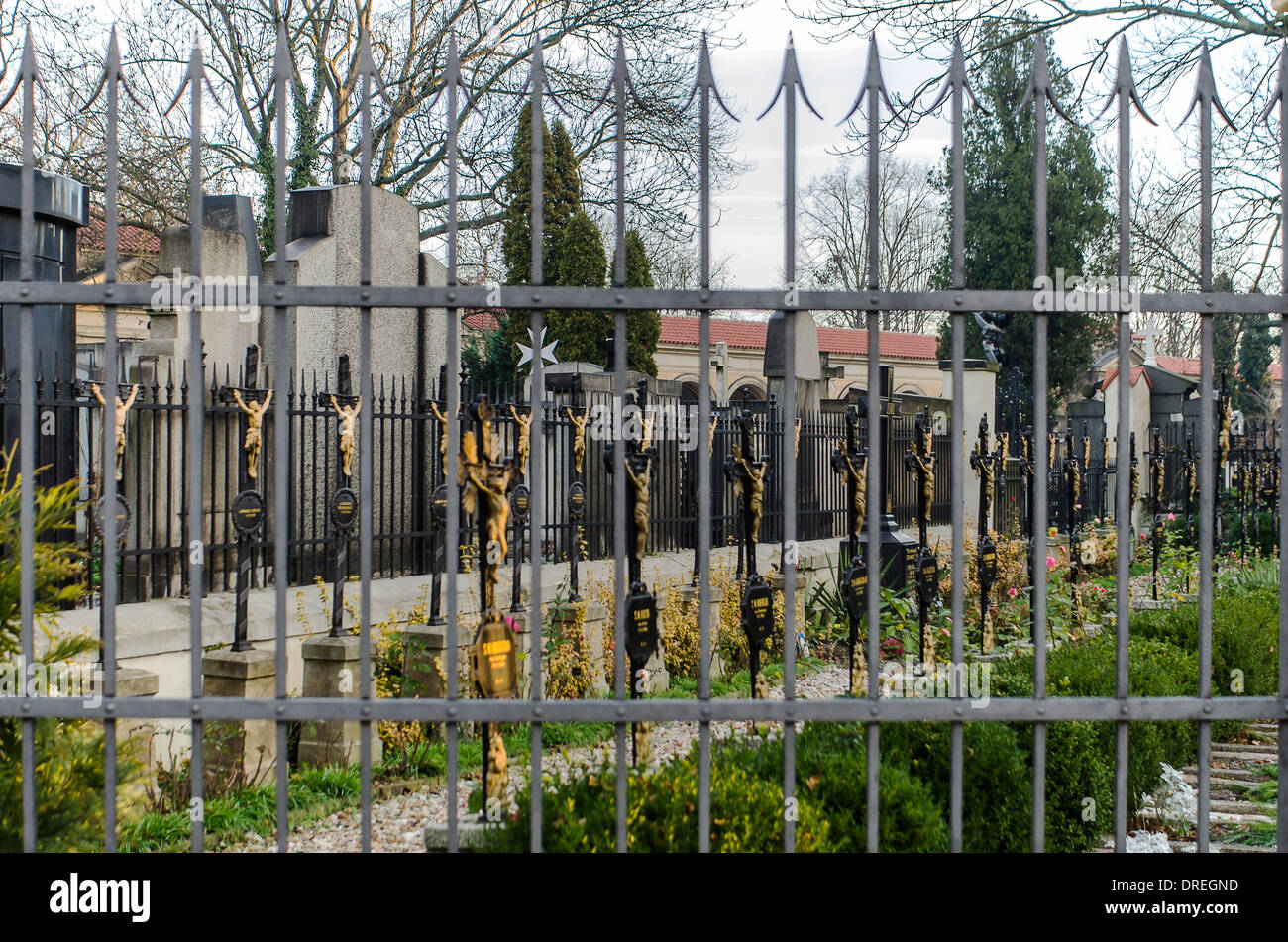 view of the grave nuns through the bars of the cemetery in Prague Stock Photo