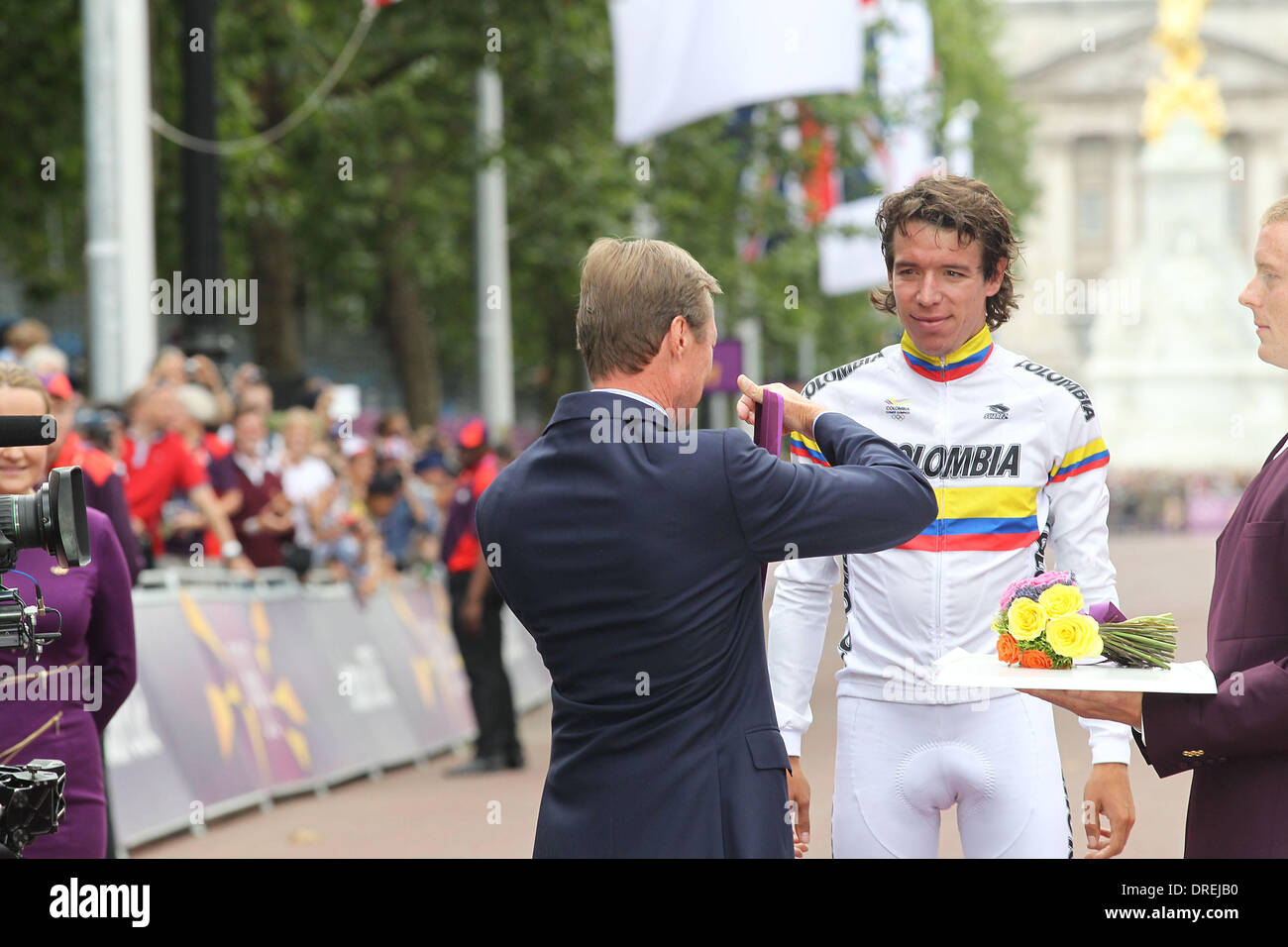 Silver medallist Rigoberto Uran Uran of Colombia presented by Grand Duc of Luxembourg Henri  during the Victory Ceremony for the Men's Road Race Road Cycling on day 1 of the London 2012 Olympic Games London, England - 28.07.12 Stock Photo