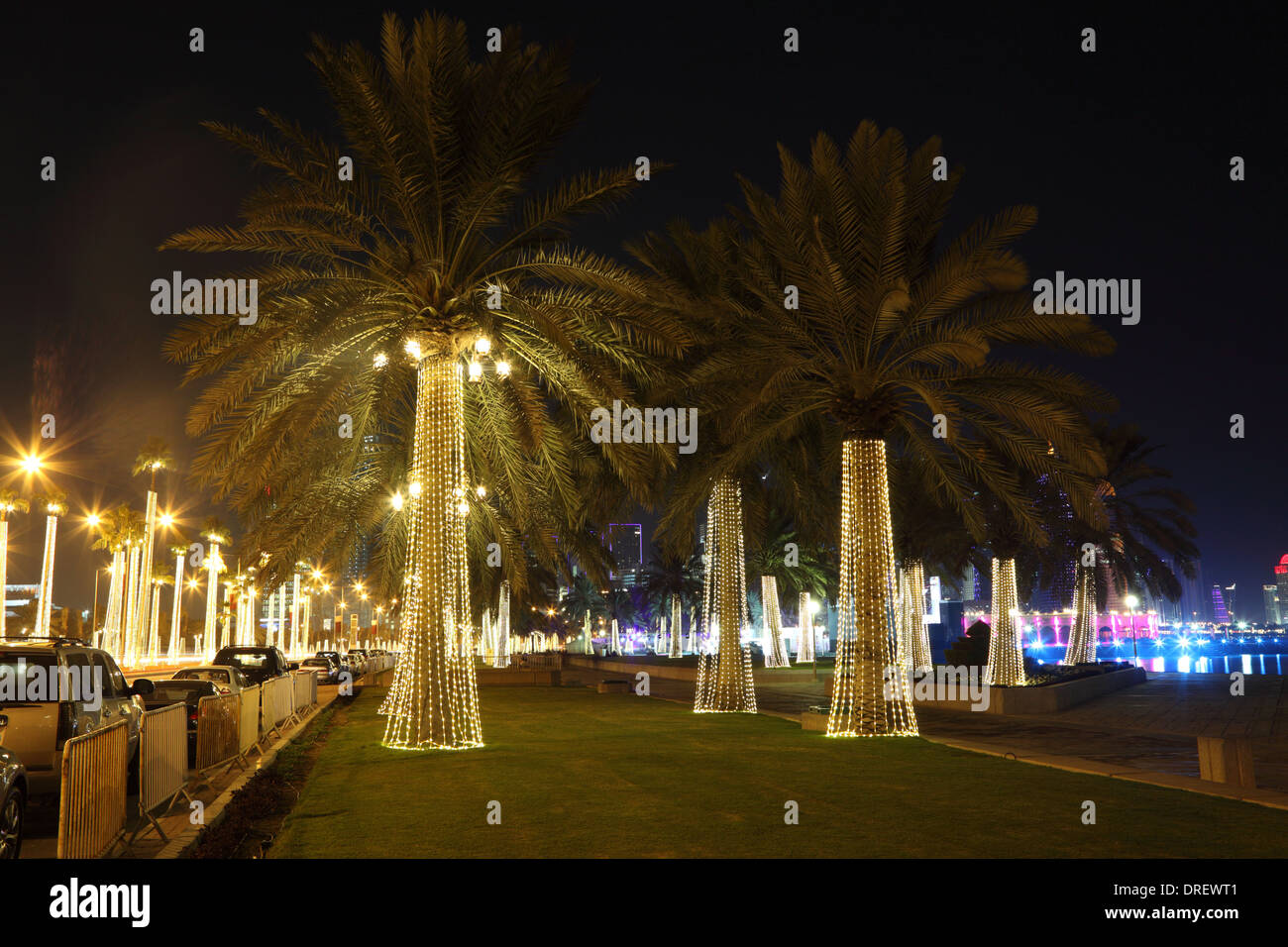 Illuminated palm trees at the corniche of Doha, Qatar, Middle East Stock Photo