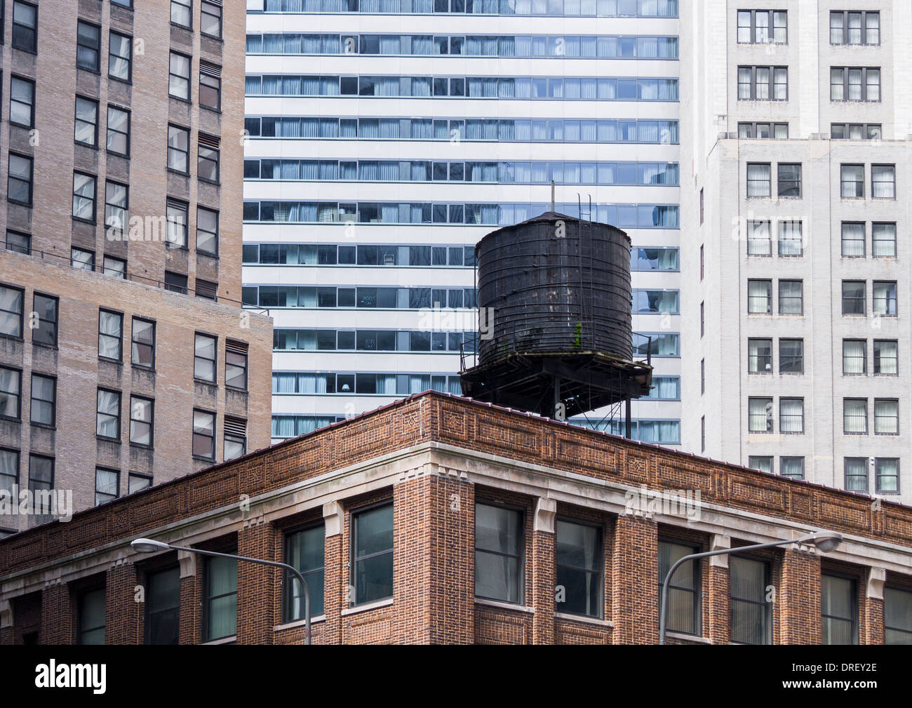 black wooden water tank on top of a building in Chicago Stock Photo