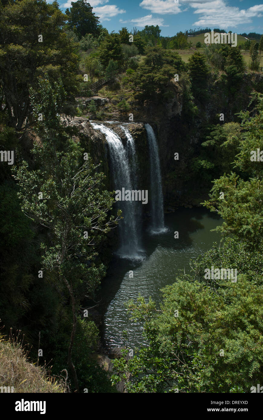 General view in sunshine with blue skies of the waterfall at Whangerai in North Island of New Zealand Stock Photo
