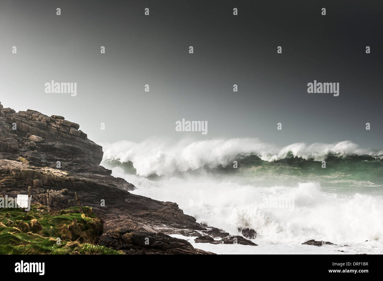 Powerful waves crashing into rocks at Sennen Cove in Cornwall. Stock Photo