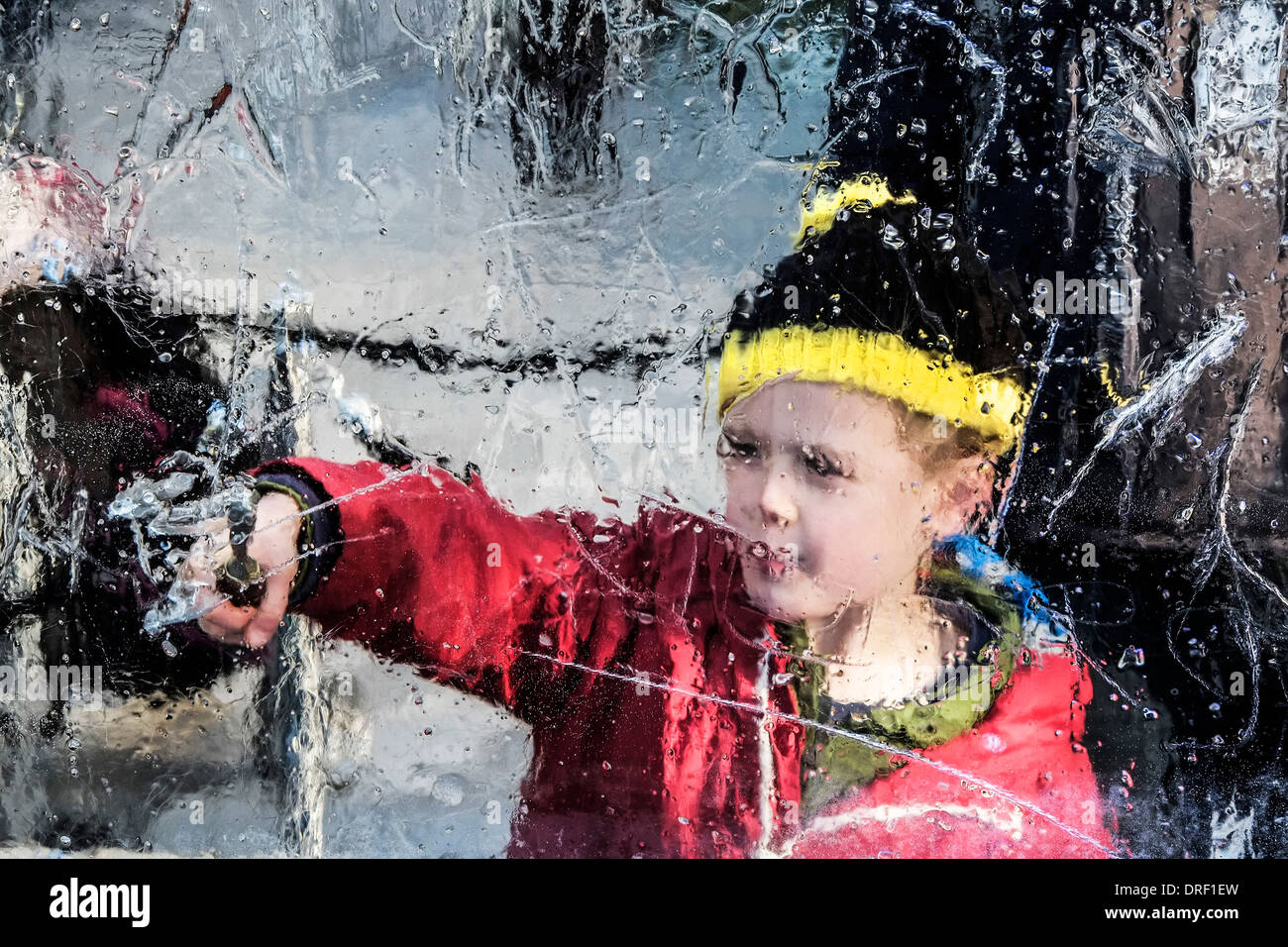Members of the public trying out ice sculpting as part of the London Ice Sculpture Festival 2014. Stock Photo