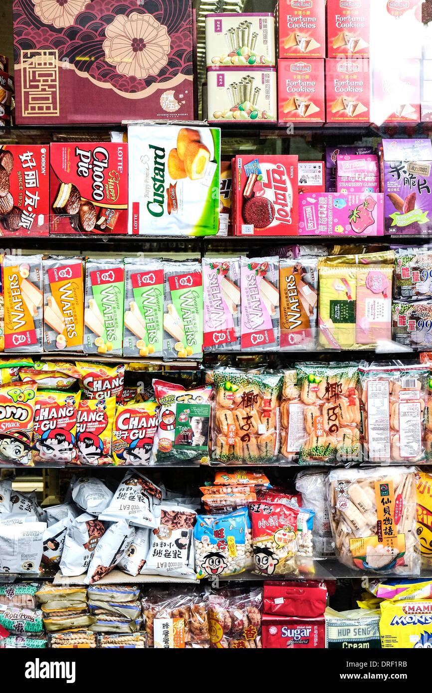 A shop window full of packaged food in A Chinese shop in Chinatown in London. Stock Photo