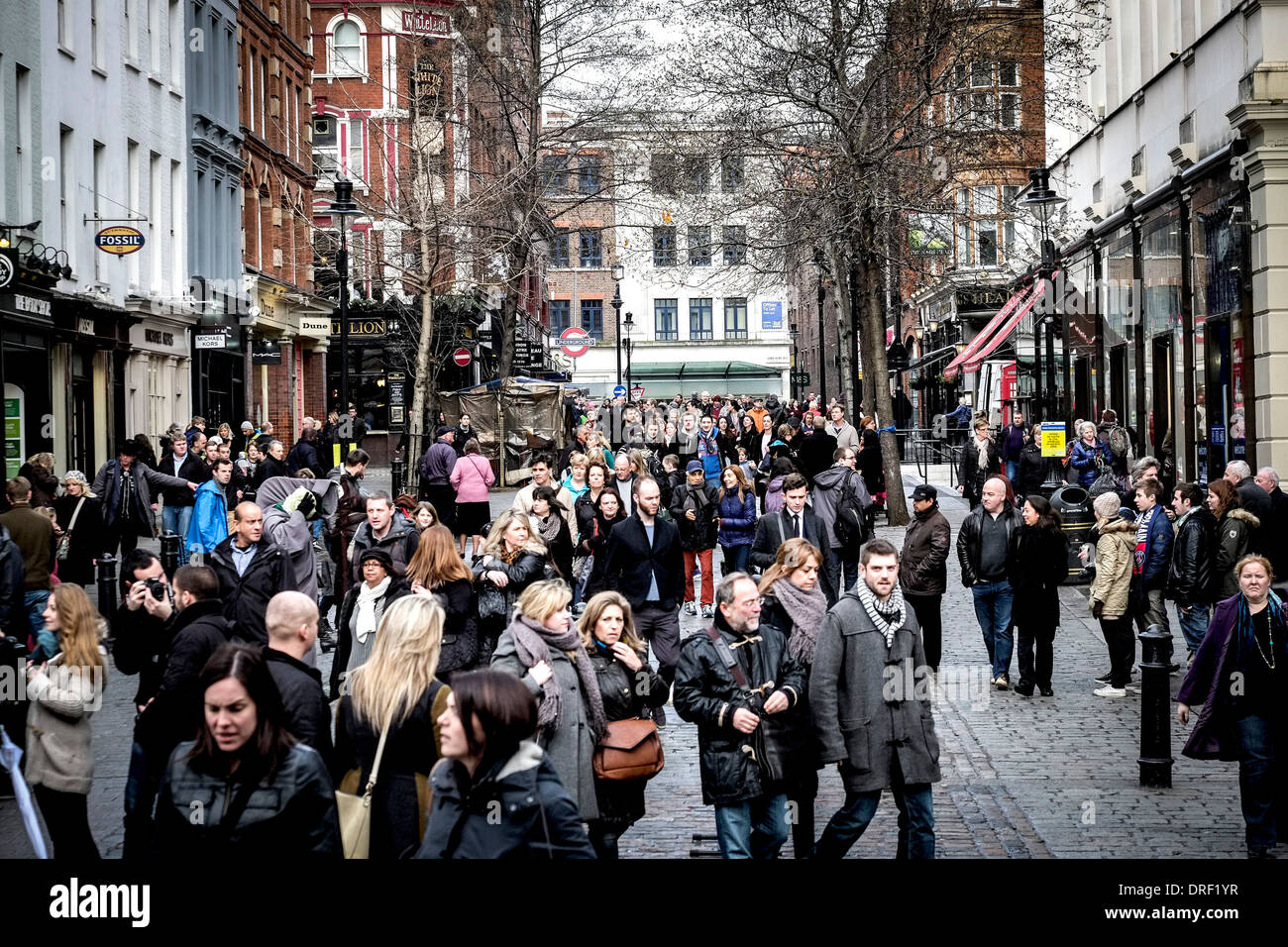 Tourists walking into Covent Garden. Stock Photo