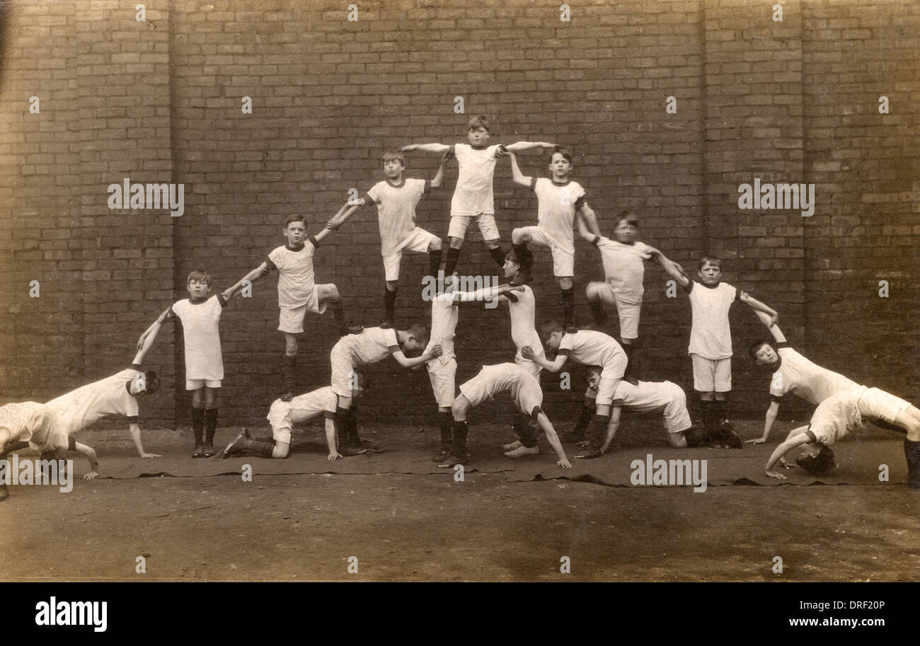 Boys form a human pyramid Stock Photo