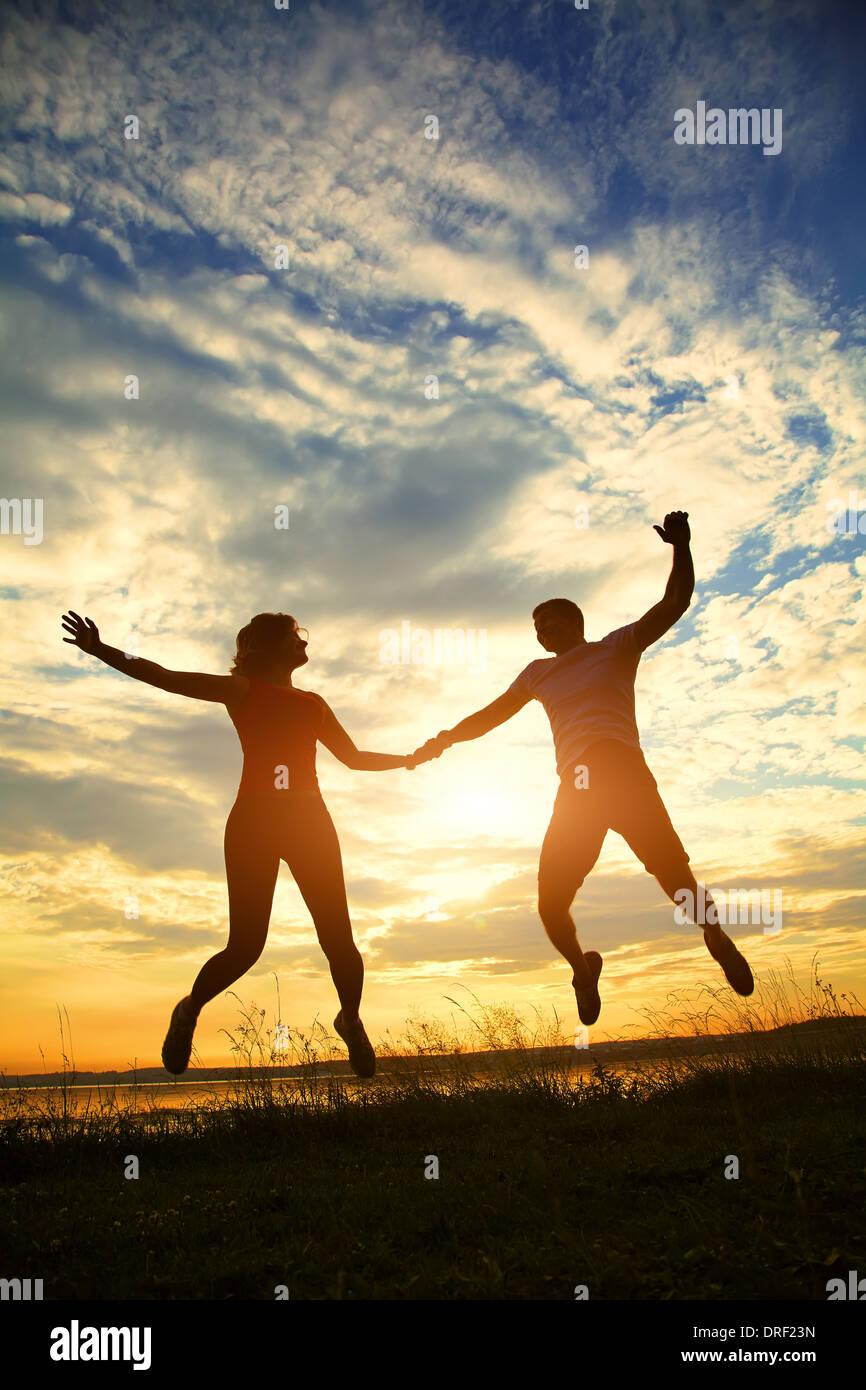 Young couple embracing silhouette hi-res stock photography and images ...