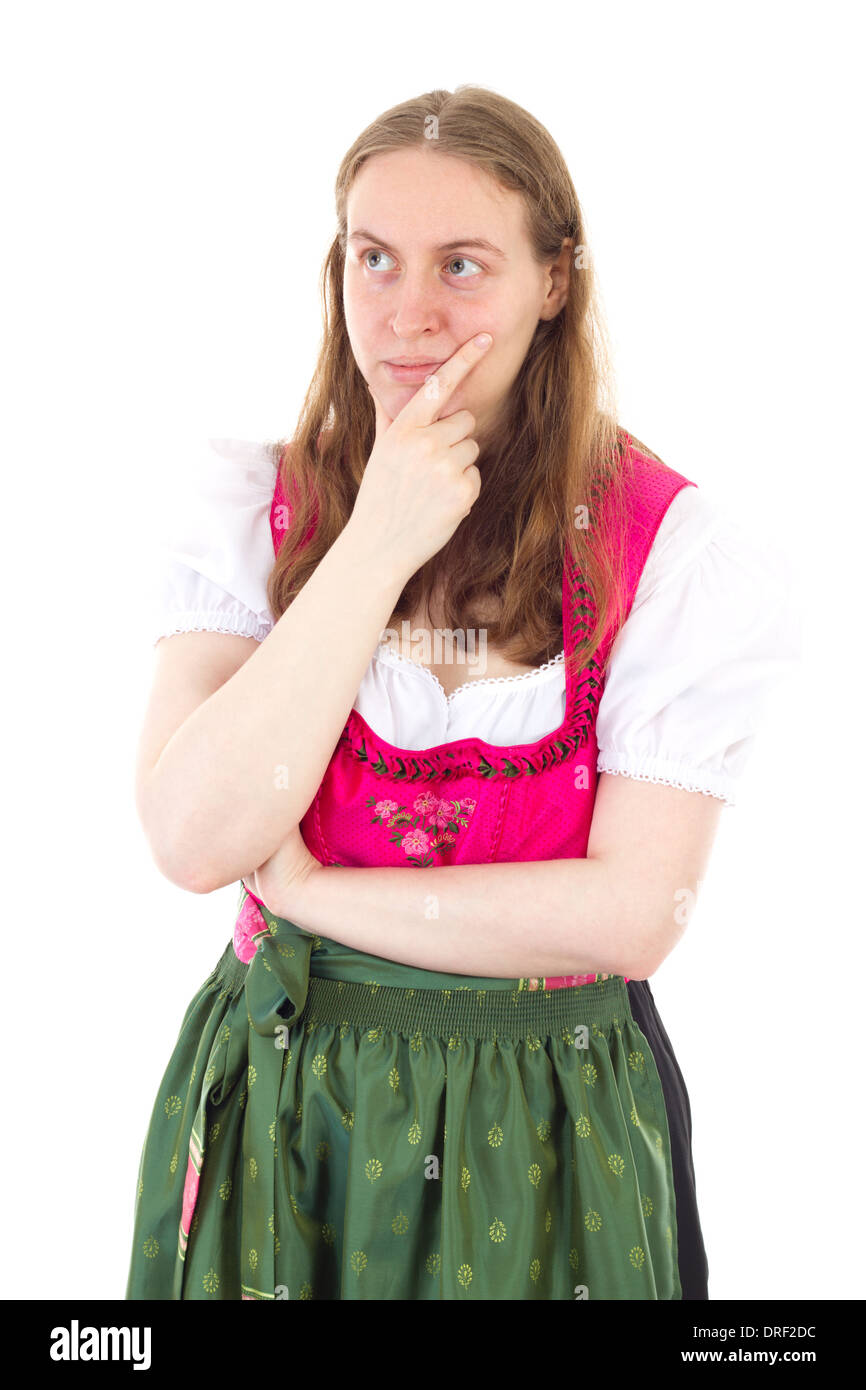 Beautiful girl in dirndl giving thought to her future Stock Photo