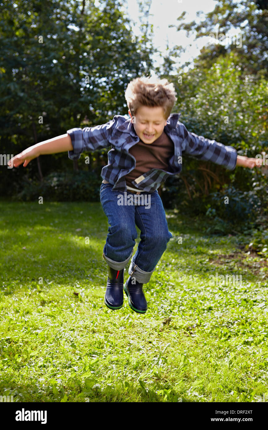 Boy Jumping In Air, Munich, Bavaria, Germany Stock Photo
