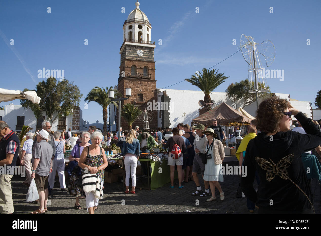 Teguise Lanzarote Canary Islands Busy with visitors to weekly Sunday market in central square Church of Our Lady of Guadalupe Stock Photo