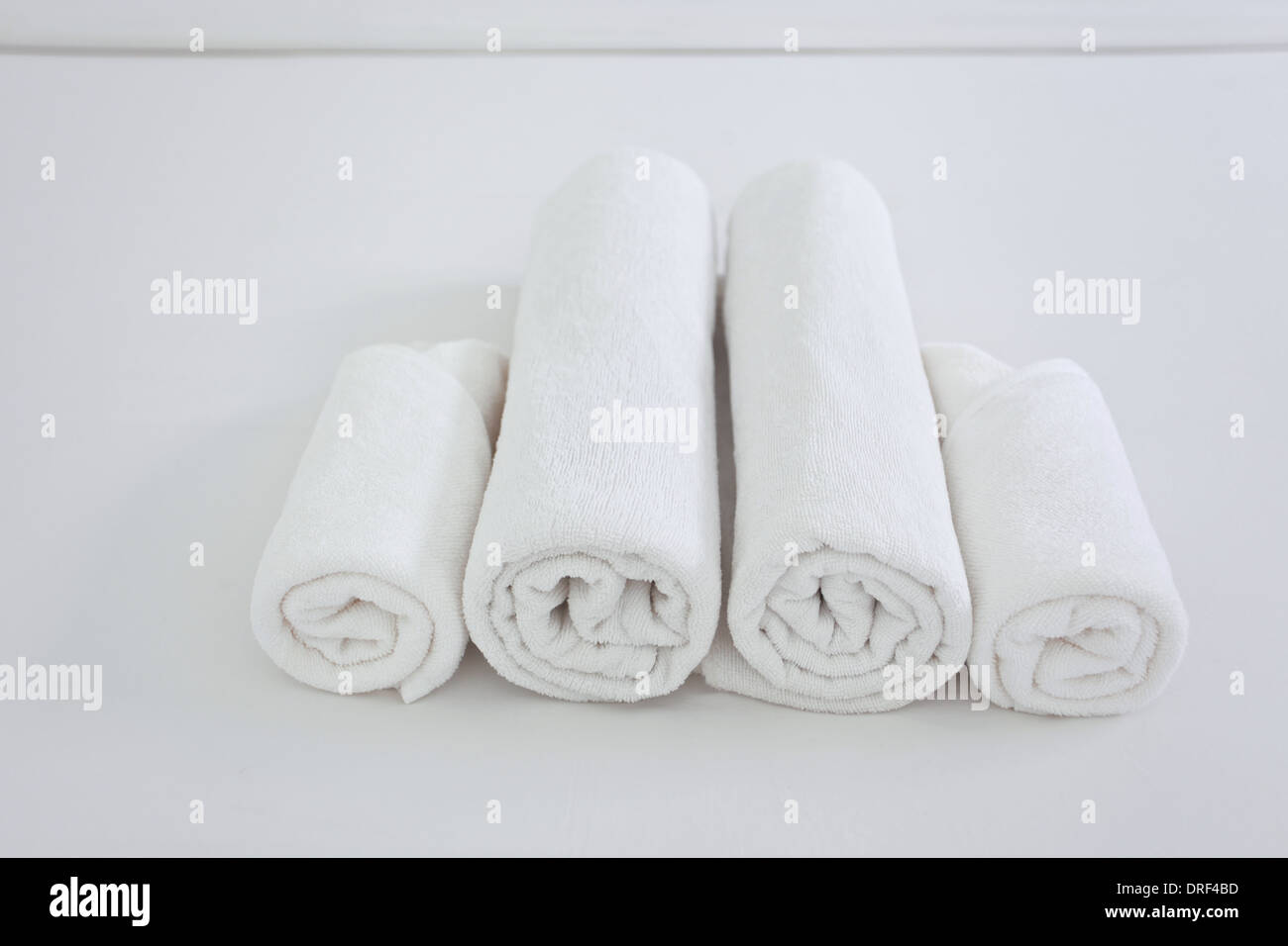 Hotel Towels on Bed Stock Photo