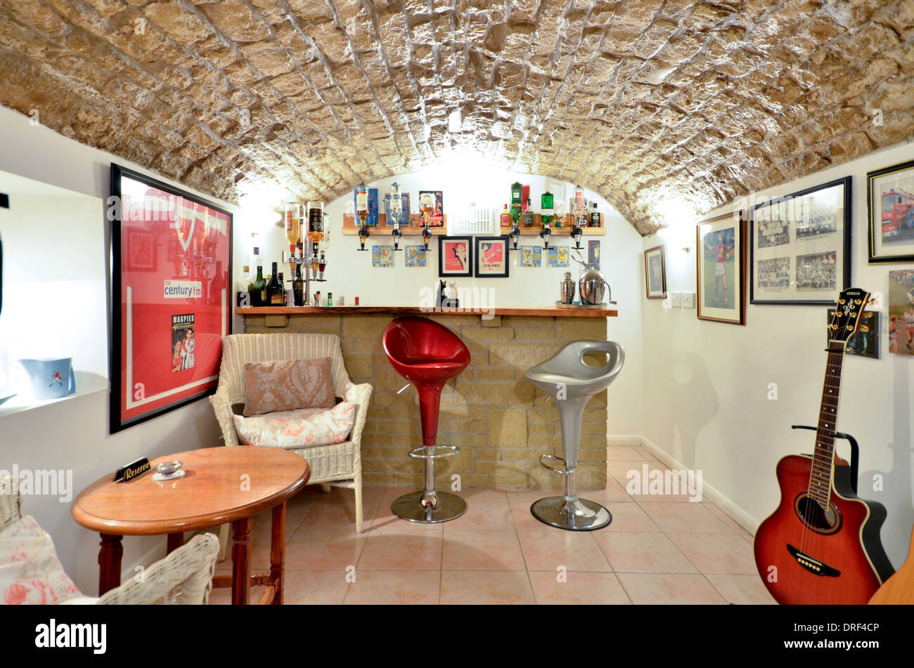 Barrel Vaulted Cellar with bar and guitar Stock Photo