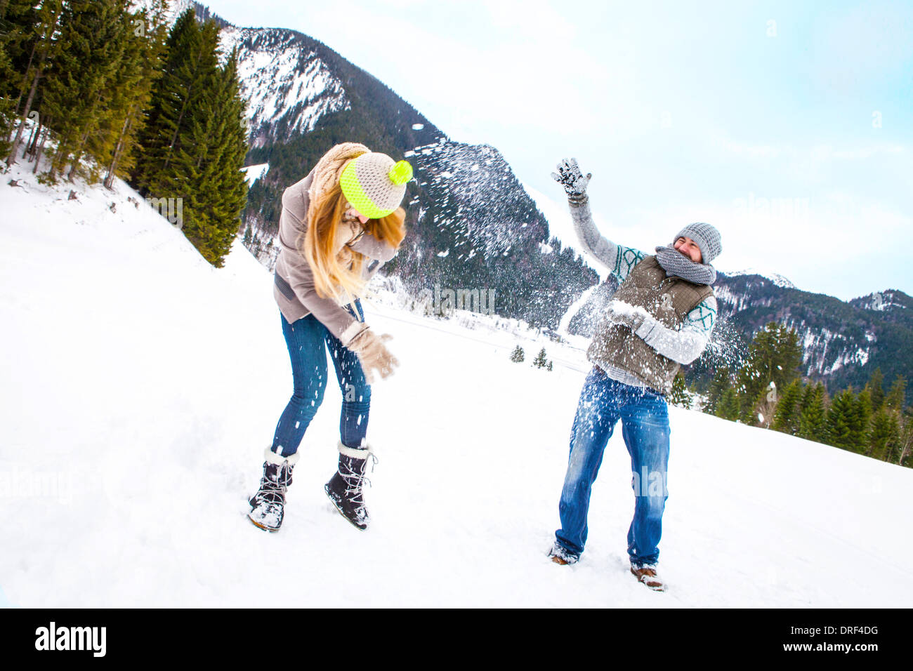 Couple Playing In Snow, Spitzingsee, Bavaria, Germany Stock Photo
