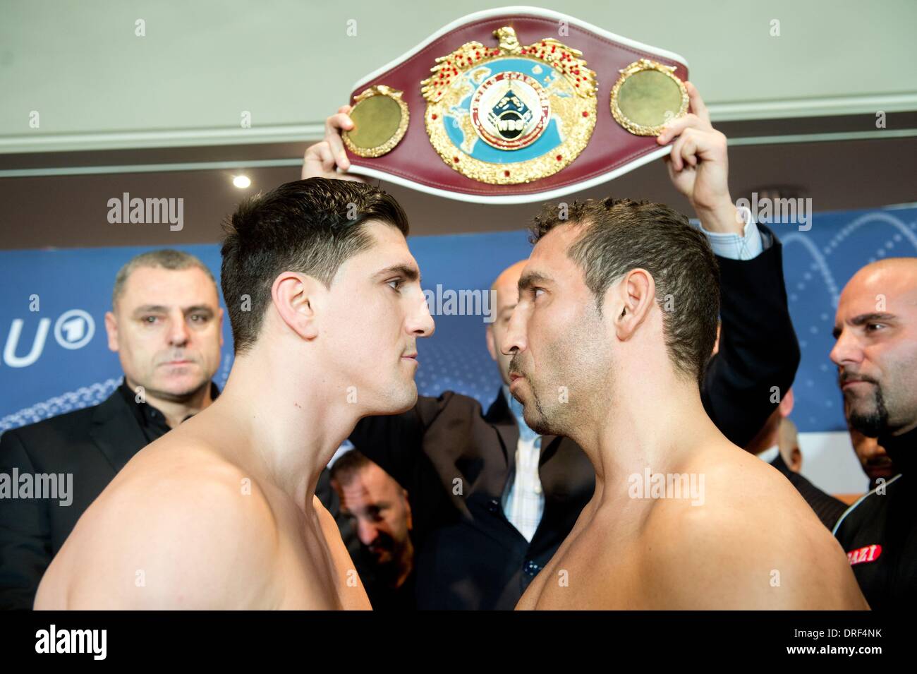 Stuttgart, Germany. 24th Jan, 2014. German WBO Cruiserweight Champion Marco Huck (L) and challenger Firat Arslan face off during the official weighing in Stuttgart, Germany, 24 January 2014. The WBO Cruiserweight Championship bout will take place on 25 January. Photo: SEBASTIAN KAHNERT/dpa/Alamy Live News Stock Photo