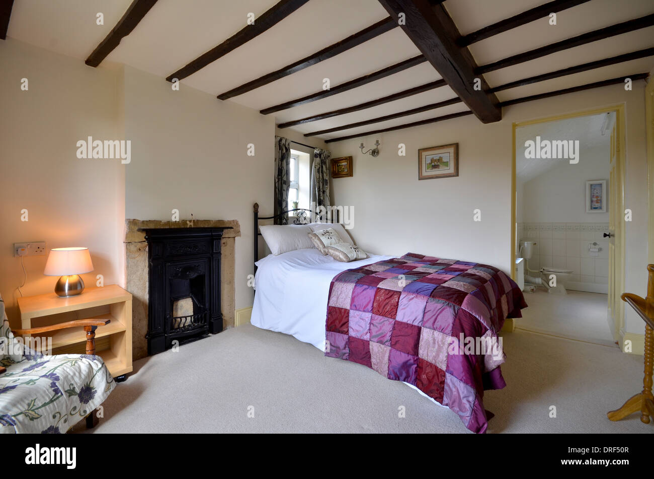 Master bedroom with en suite bathroom Stock Photo - Alamy