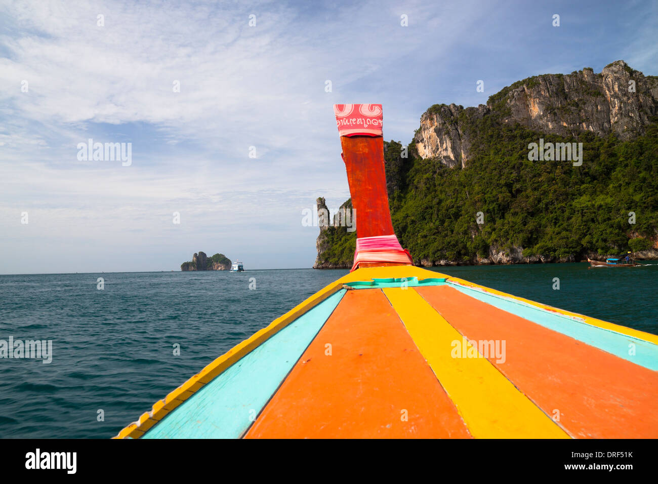 Detail of long tail boat and beautiful scenic coastline of Phi Phi Island in Thailand. Stock Photo