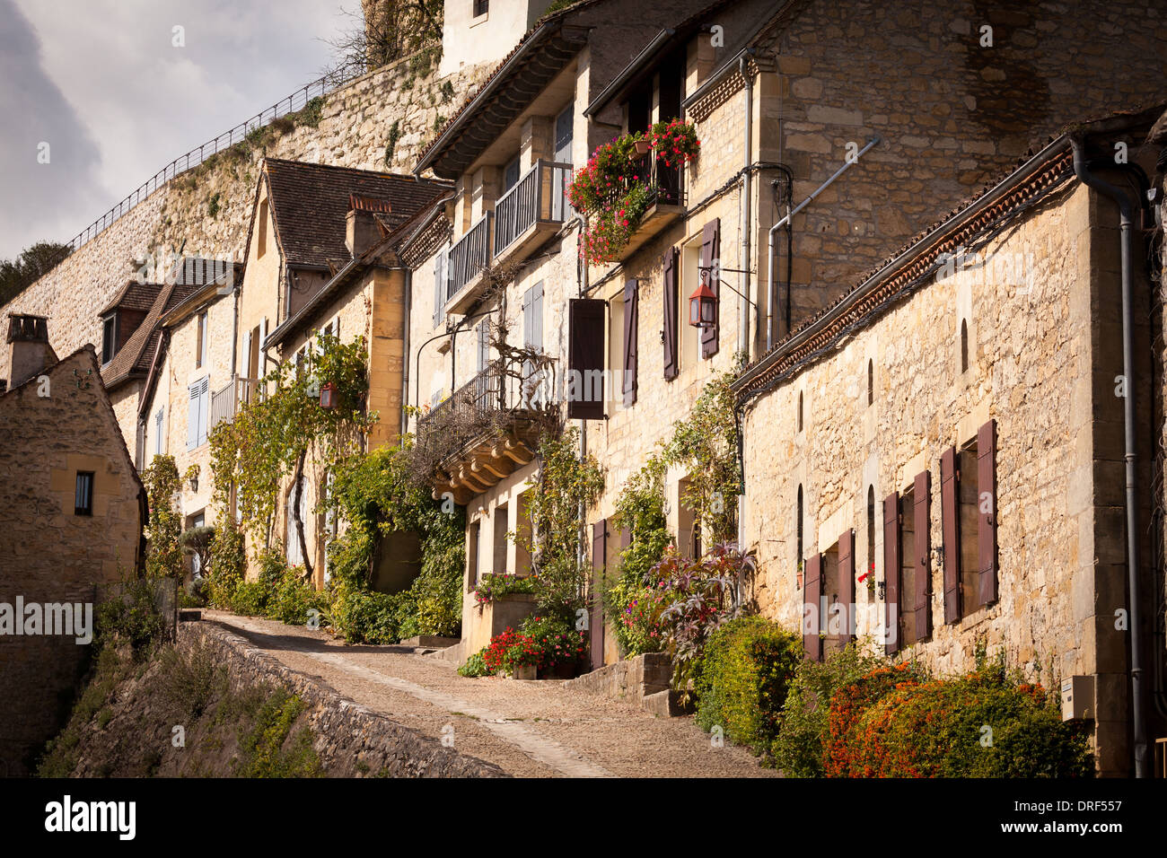 Beynac-et-Cazenac, Dordogne, France, Europe. Tranquil scene up traditional cobbled village street. Stock Photo