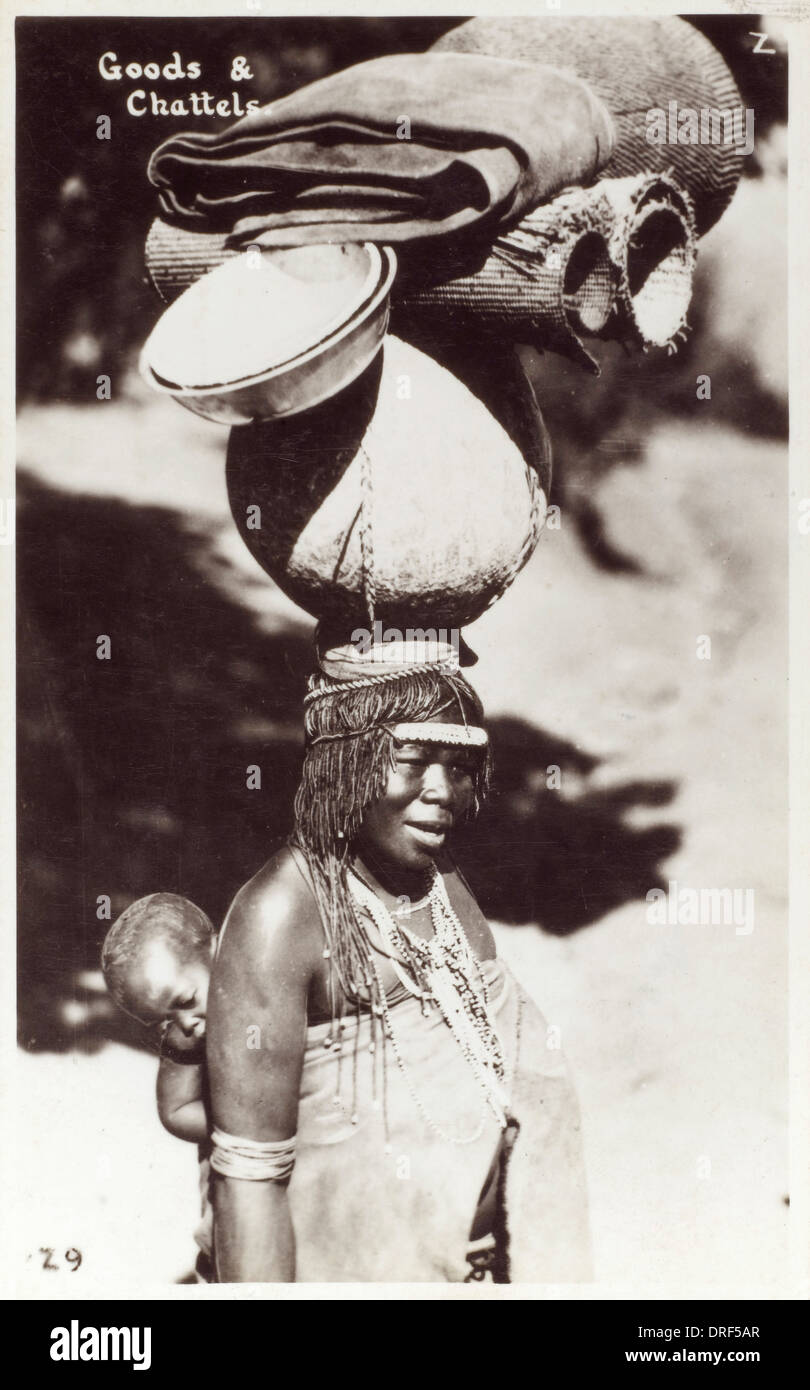 South African woman carrying goods on her head Stock Photo