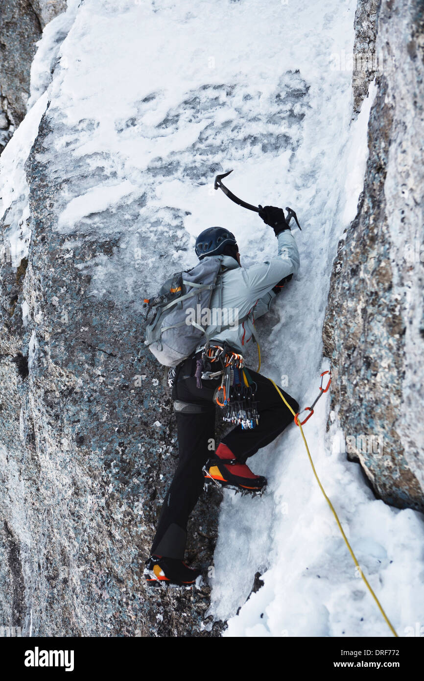 Alpinist ice climbing, on the rope, using ice axe, Zugspitze, Bavaria