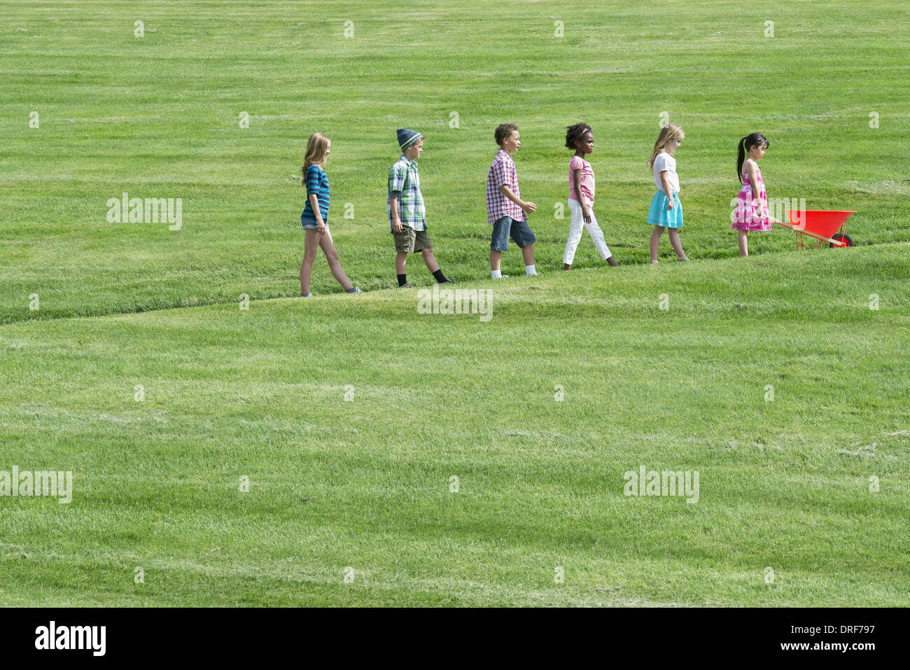 Utah USA group children walking up slope height order Stock Photo