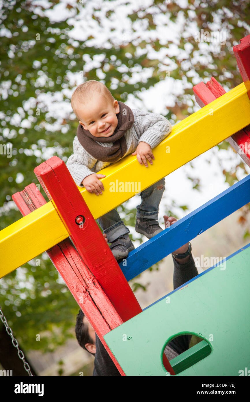 Toddler climbing on jungle gym, Osijek, Croatia Stock Photo