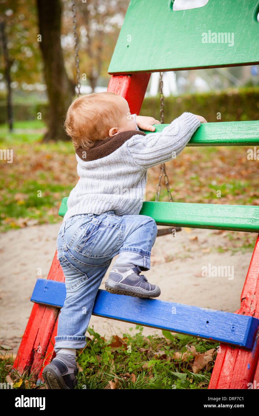 Toddler climbing on jungle gym, Osijek, Croatia Stock Photo