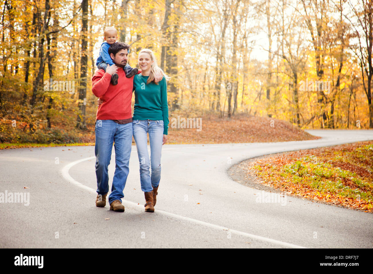 Parents together with son walking on road, Osijek, Croatia Stock Photo