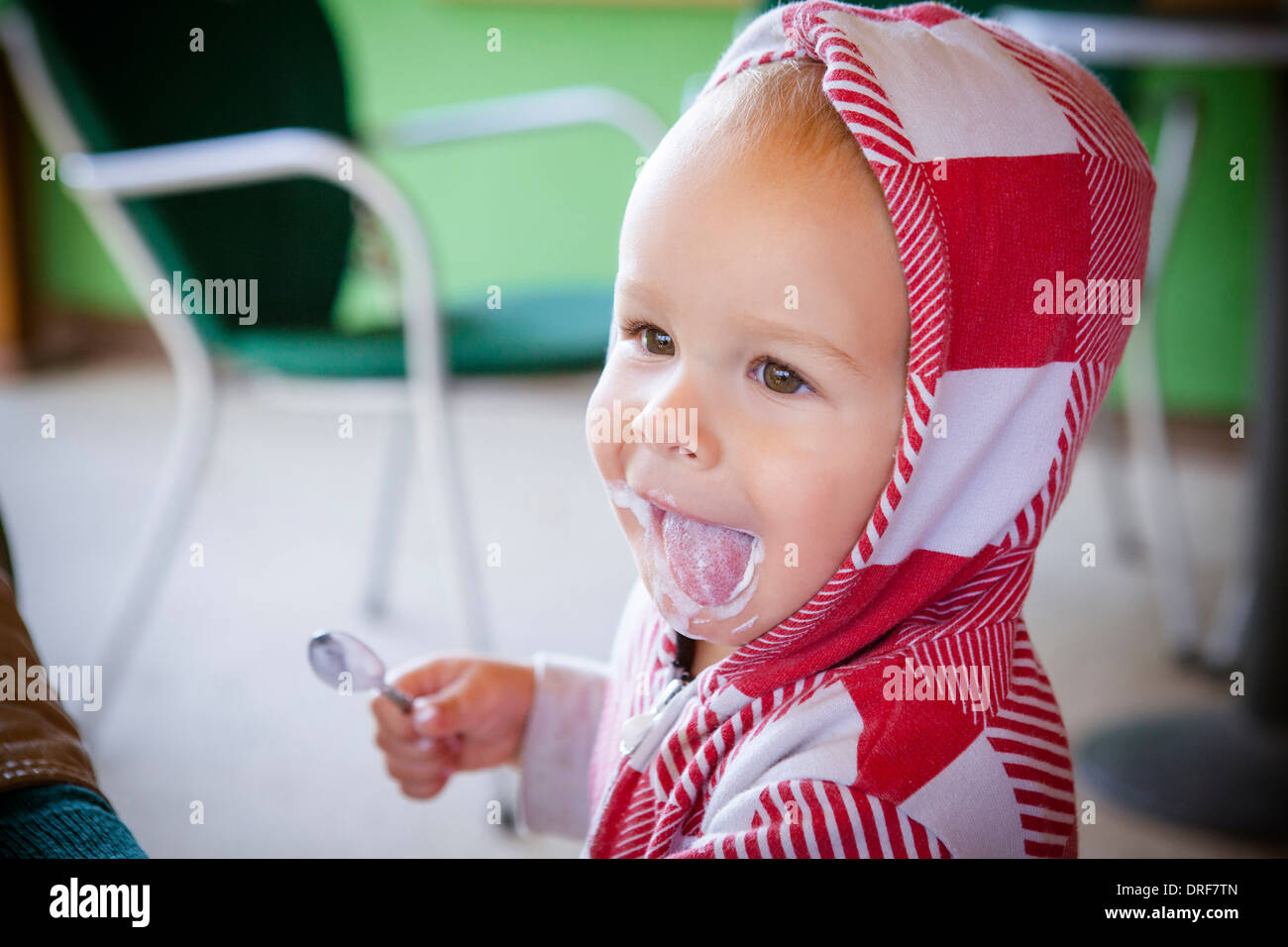 Toddler licks his lips after a snack, Osijek, Croatia Stock Photo