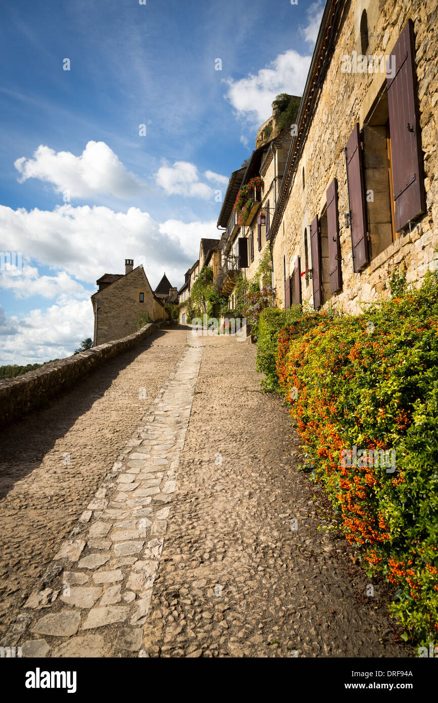 Beynac-et-Cazenac, Dordogne, France, Europe. Tranquil scene up traditional cobbled village street. Stock Photo