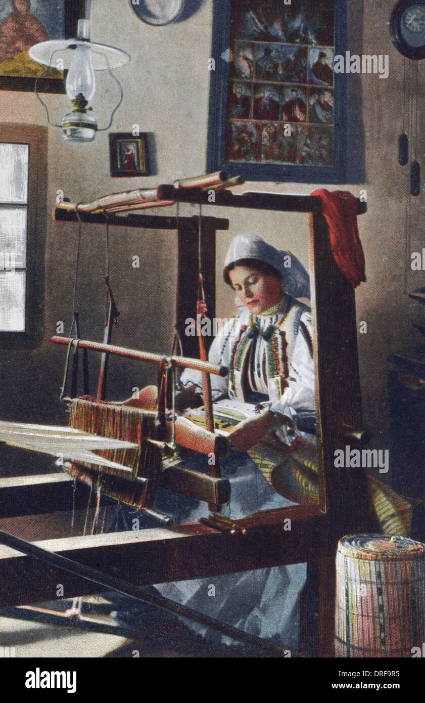 Romanian Woman - making fabric Stock Photo