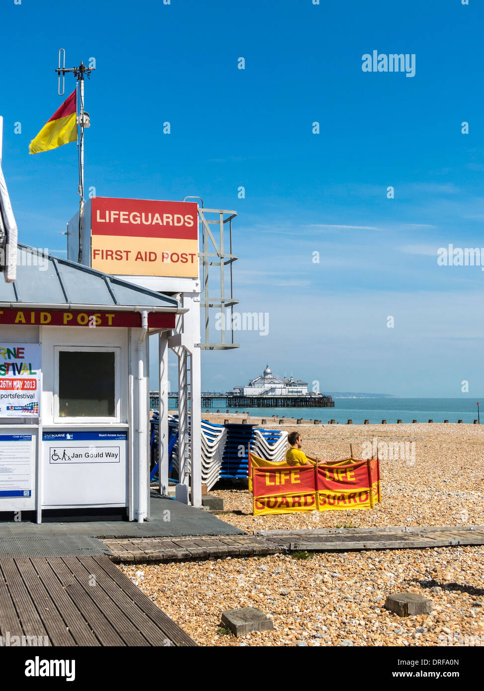 Lifeguard station and First Aid Post on Eastbourne Beach with pier