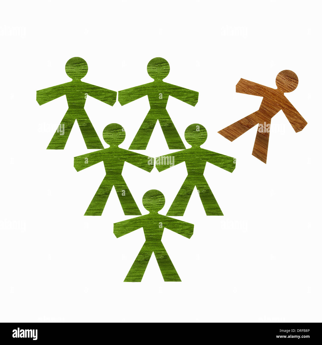 paper cut out representing people green one brown Stock Photo
