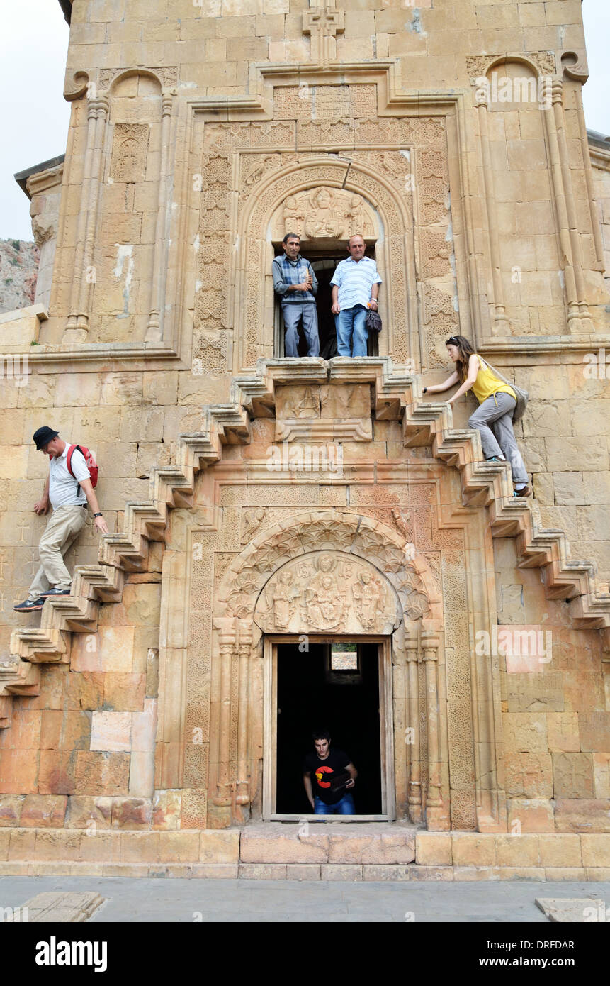 Tourists walk up stairs of Surb Astvatsatsin (Holy Mother of God) Church, Noravank, Armenia Stock Photo
