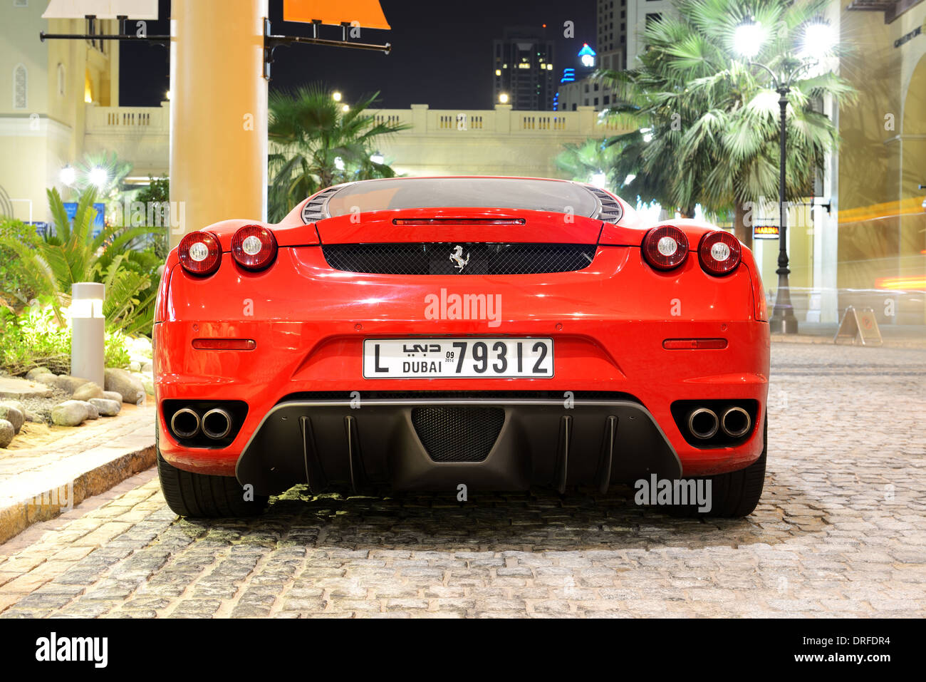 The luxury sport car is on the Walk at Jumeirah Beach Residence, Dubai, United Arab Emirates Stock Photo