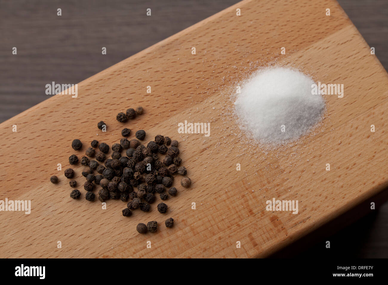 salt and pepper on wooden background Stock Photo