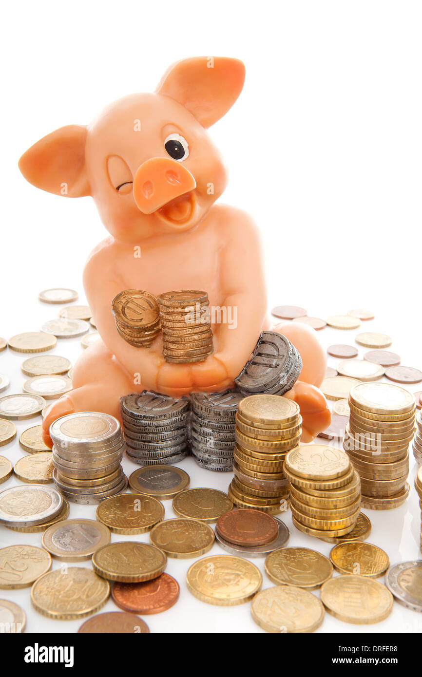 piggy bank and piles of coins over white background Stock Photo - Alamy