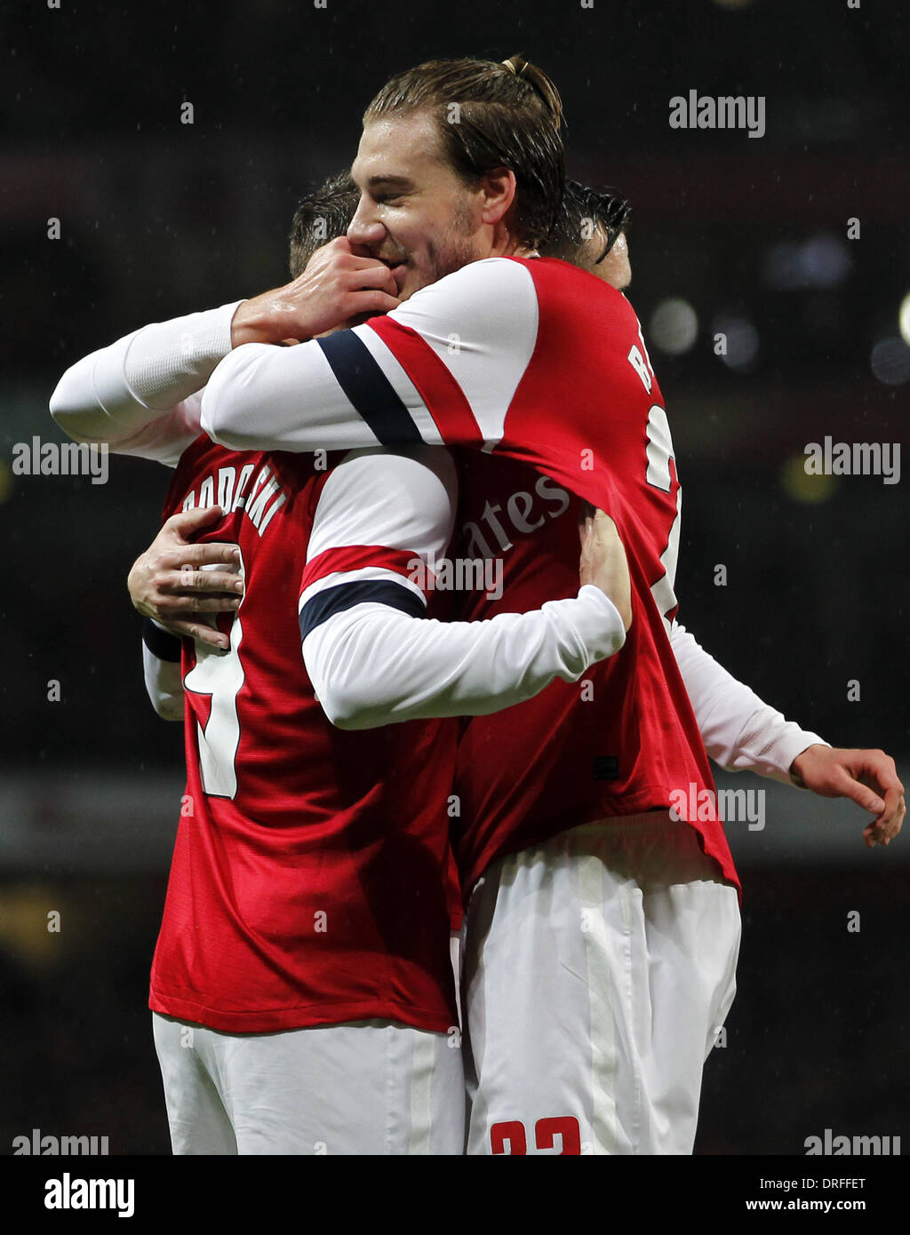 London, UK. 24th Jan, 2014. Nicklas Bendtner(R) of Arsenal congratulates Lukas Podolski scoring second goal during FA Cup Fourth Round match between Arsenal and Coventry City at Emirates Stadium in London, Britain on Jan. 24, 2014. Arsenal won 4-0. Credit:  Wang Lili/Xinhua/Alamy Live News Stock Photo