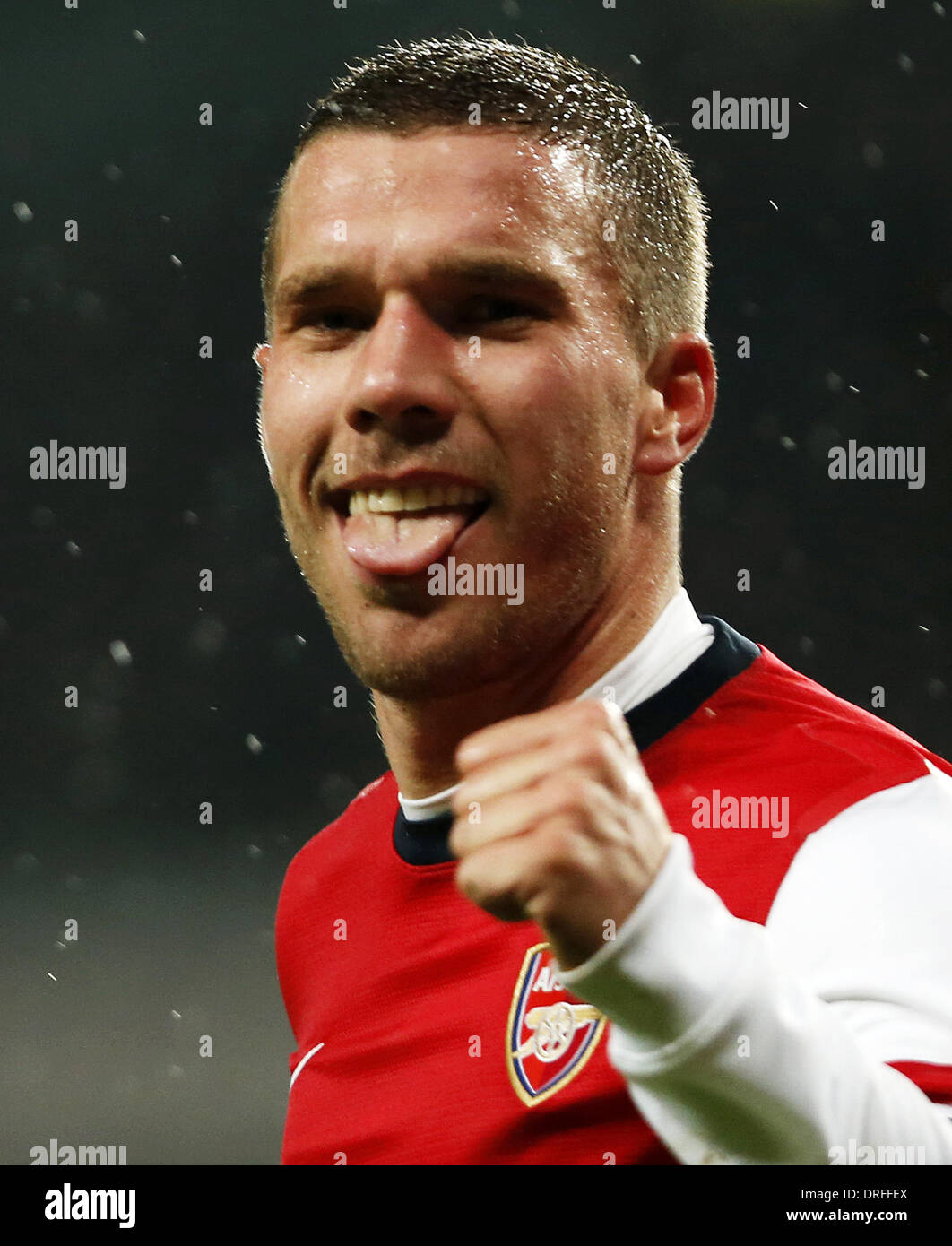 London, UK. 24th Jan, 2014. Lukas Podolski of Arsenal celebrates scoring his second goal during FA Cup Fourth Round match between Arsenal and Coventry City at Emirates Stadium in London, Britain on Jan. 24, 2014. Arsenal won 4-0. Credit:  Wang Lili/Xinhua/Alamy Live News Stock Photo
