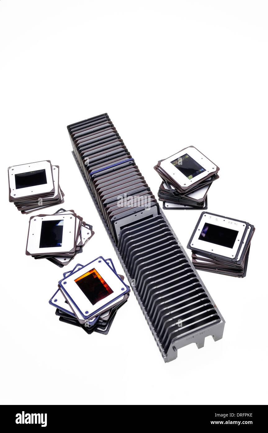 Slide tray with piles of old slides on white background - memories from the past Stock Photo