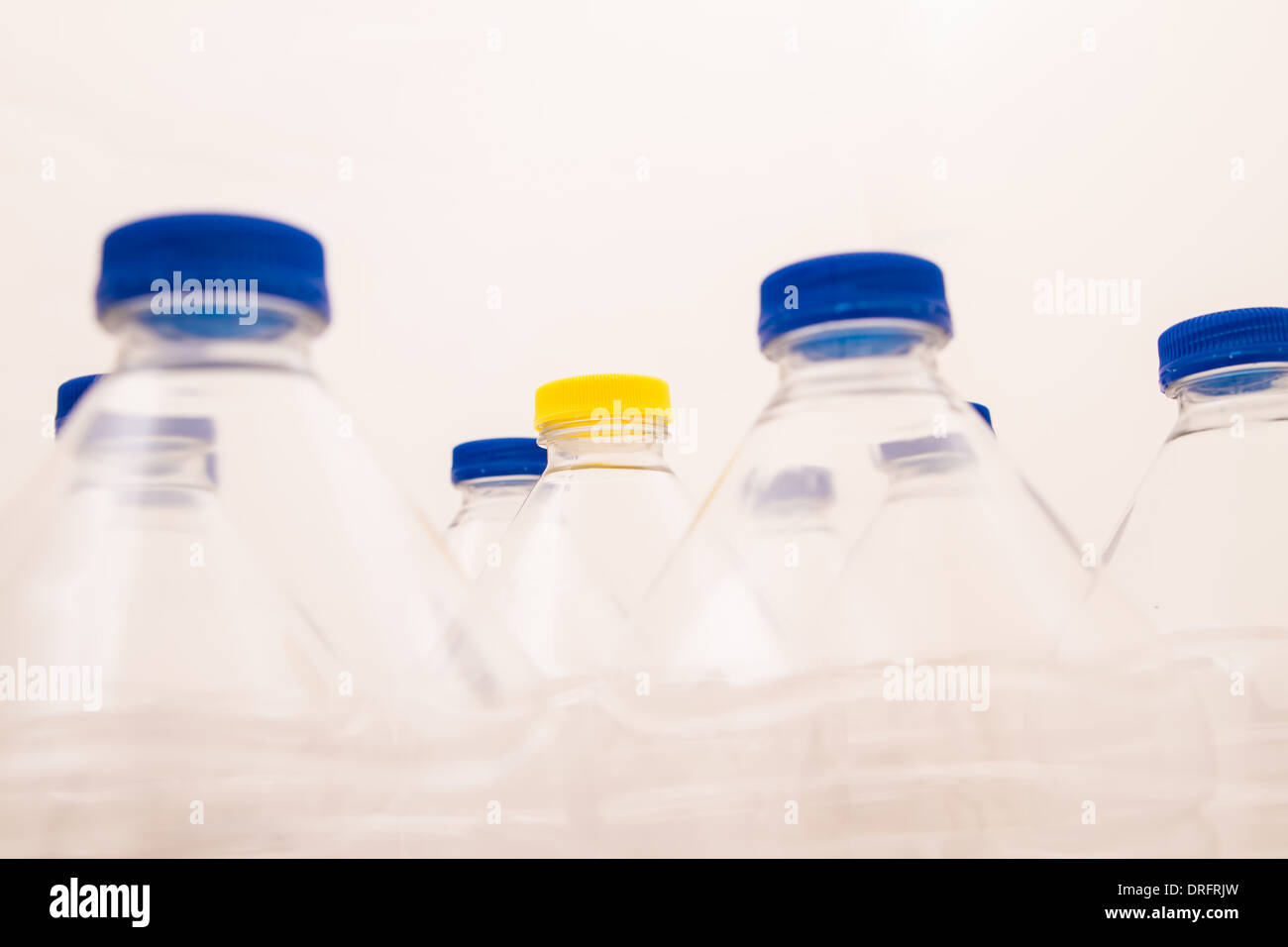 Empty bottles of mineral water, one with a different lid Stock Photo Alamy