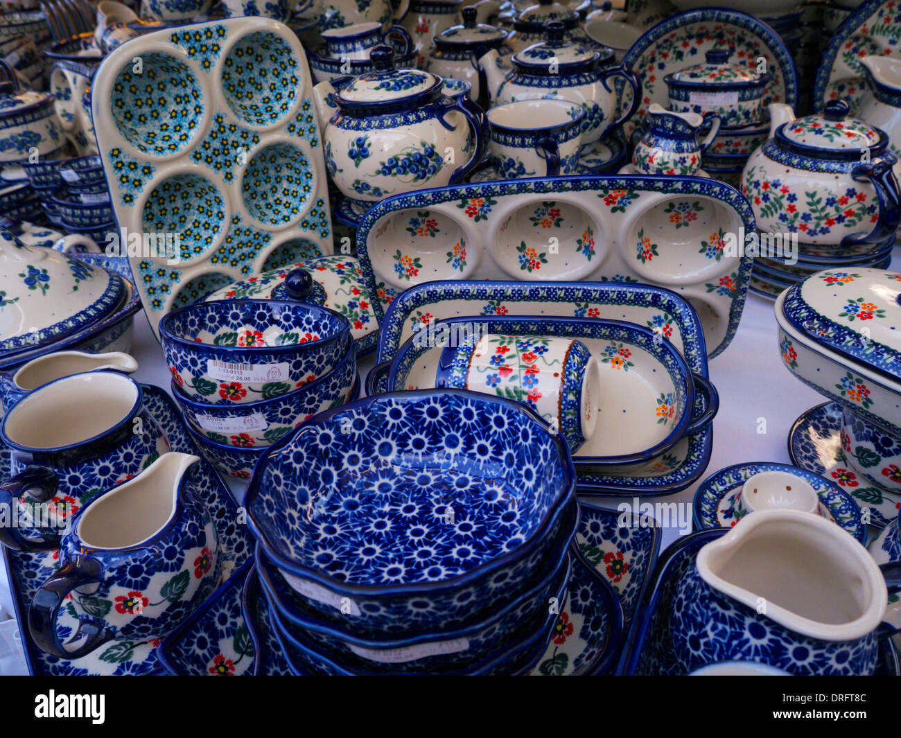 A variety of Polish pottery lines the shelves at the Christmas markets in Krakow, Poland Stock Photo