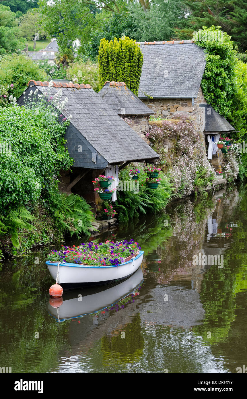 Pontrieux Brittany France riverside wash houses and flower filled boat