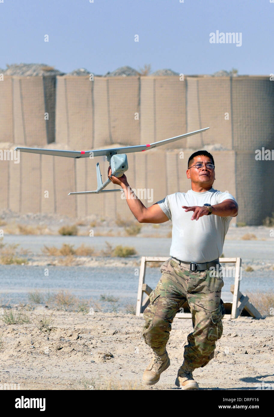 US Army Sgt. Cliff A. Taijeron launches a Raven unmanned aerial drone October 31, 2013 at Forward Operating Base Spin Boldak, Afghanistan. Stock Photo
