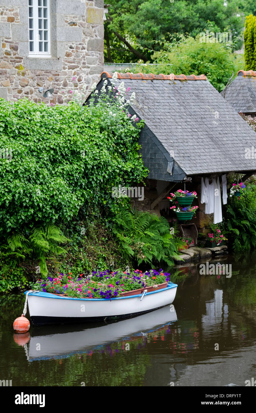 Pontrieux Brittany France riverside wash houses and flower filled boat