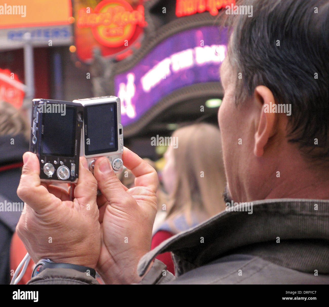 A tourist in the Times Square section of Manhattan, New York takes